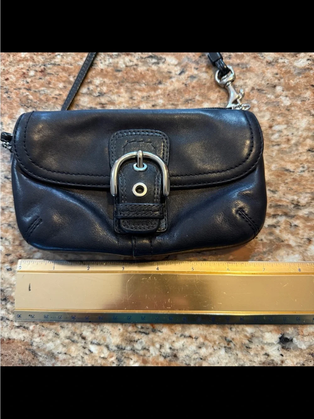 Coach, Soho, wristlet Black Leather Wristlet with Buckle Detail excellent condi